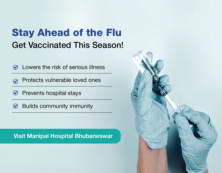 Doctor holding flu vaccine syringe at Manipal Hospital Bhubaneswar