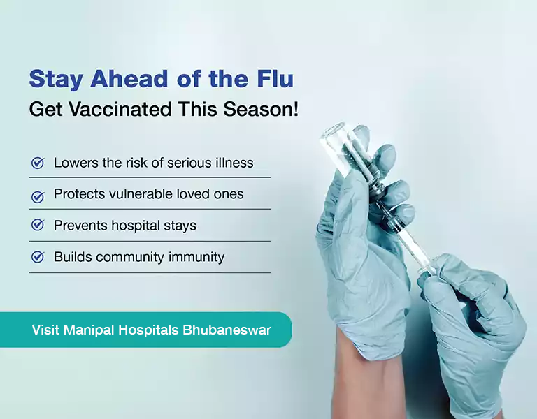 Doctor holding flu vaccine syringe at Manipal Hospital Bhubaneswar
